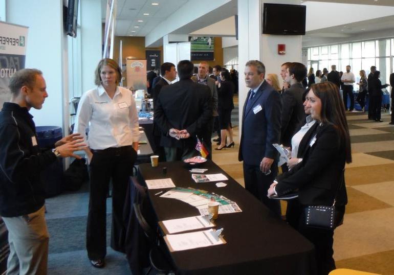 Students and employers interact during a career fair.